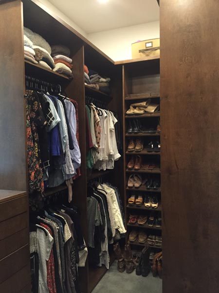 Closet Full of Clothes & Shelving Built By Garner Woodworks